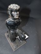 An Antique carved figure of a kneeling blackamoor