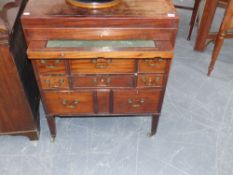 A late Georgian mahogany batchelor's washstand cabinet with fitted writing slide together with a
