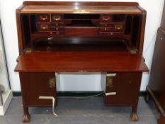 An interesting Art Nouveau mahogany and brass mounted bureau possibly American