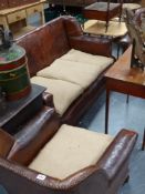 An Art Deco leather upholstered three piece suite