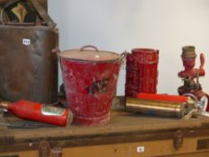 A group of vintage fire fighter accessories to include extinguisher, hose coupling, pond supply