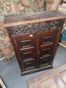 A 19th.C. grained pine hall cabinet with panelled doors