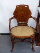 An antique mahogany Georgian style paint decorated broad seated open armchair