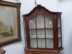 An antique walnut dutch style wall cabinet