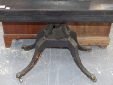 An unusual Regency ebonised fold over card table