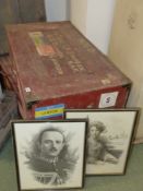 A pair of antique shipping trunks together with portraits of the former owners