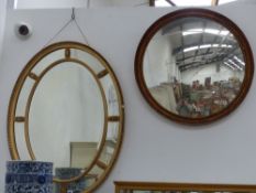 An antique Neo-classical style oval gilt mirror