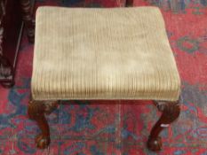 An antique walnut framed dressing stool