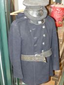 A fireman's double breasted dress jacket, trousers and two caps