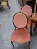 A pair of 19th.c.spoon back side chairs on slender cabriole legs