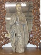 A large Antique carved wood figure of a standing saint, possibly Colonial