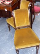 A set of eight Victorian oak dining chairs with overstuffed upholstery