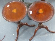 A pair of mahogany and inlaid wine tables