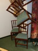 A set of four fruitwood dining chairs