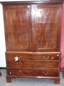 An early 19th.C.mahogany linen press with fitted slides