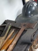 An American fireman's helmet together with four fire axes of WW II Period, a pair of protective