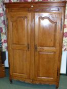 A French provincial Fruitwood armoire