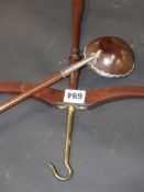 An unusual white metal mounted polished coconut and treen ladle together with a country house coat