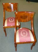 A PAIR continental walnut dining chairs with inlaid decoration