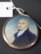 A pair of Georgian watercolour miniature oval portraits of a gentleman and lady. Framed as one in