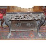 A well carved Chinese hardwood centre table pierced dragon apron with pierced undertier and ball and