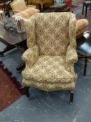 A good antique Geo.III.style large wing back armchair together with a similarly upholstered