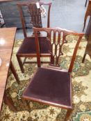 A set of six Chippendale period mahogany dining chairs with gothic form pierced backs