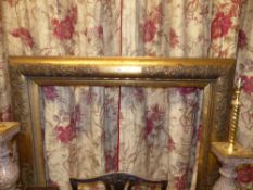 A large gilt frame moulded sides with floral and strapwork corners