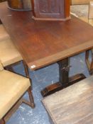 A hardwood trestle end refectory table