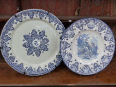 A large Antique blue and white Delft type charger together with a similar later example with figural