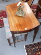 A Georgian mahogany Pembroke table on square taper legs with brass castors