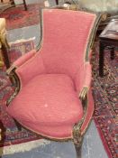 An antique Louis XVI style carved show frame salon armchair with original paint decoration