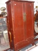 An Oriental red lacquer hall cabinet