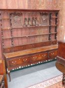 An 18th.C. and later oak low dresser with three crossbanded drawers and raised plate rack over