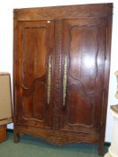 A French provincial oak two door armoire frontage with carved decoration