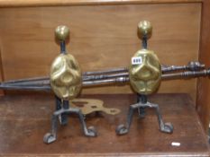 A set of Georgian steel fire implements and a pair of Art Nouveau fire dogs
