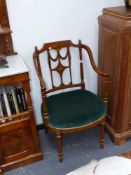 An antique satinwood Sheraton style paint decorated open armchair