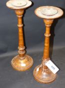 A pair of turned burl wood candlesticks with weighted bases