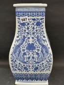 A Chinese blue and white squared form vase overall scrolling foliage with phoenix birds. Seal mark