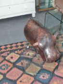 A Liberty style vintage leather hippo form footstool by omersa