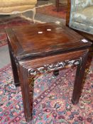 A Chinese carved hardwood square tabouret with pierced fruit apron