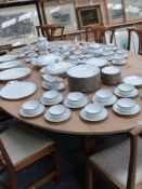 A large pine and fruitwood drop leaf dining table on shaped cabriole legs