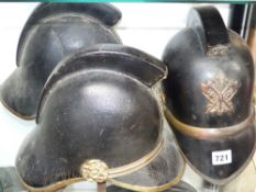 Three Victorian leather and brass mounted fireman's helmets