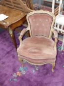 A pair of French Louis XV style salon armchairs