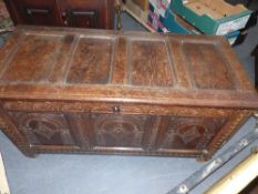 An 18th.C.Oak panel chest with carved panels and frieze