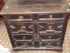 A late 17th Century and later oak chest of four long drawers