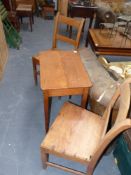 A small fruitwood table and a pair of country side chairs