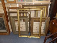 A collection of gilt picture frames, some with carved decoration.