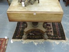 An unusual early 19th.c. mahogany drop leaf pedestal table on carved column platform base and tall