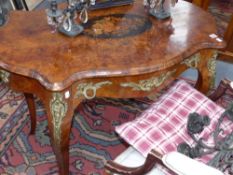 A 19th Century burr walnut inlaid and bronze mounted ladies writing table with frieze drawer. In the